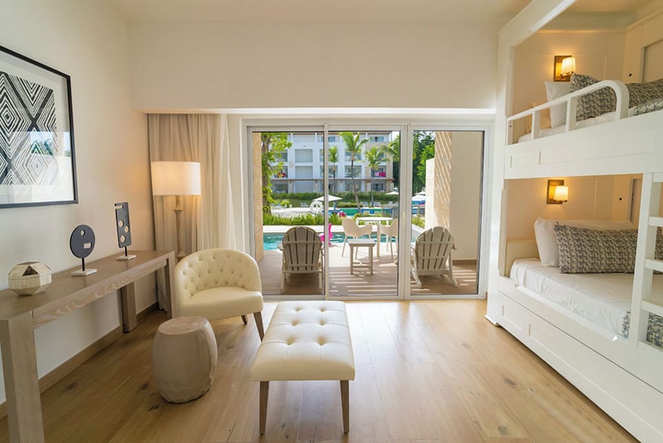 Relax on plush seating as sunlight pours through wide sliders.