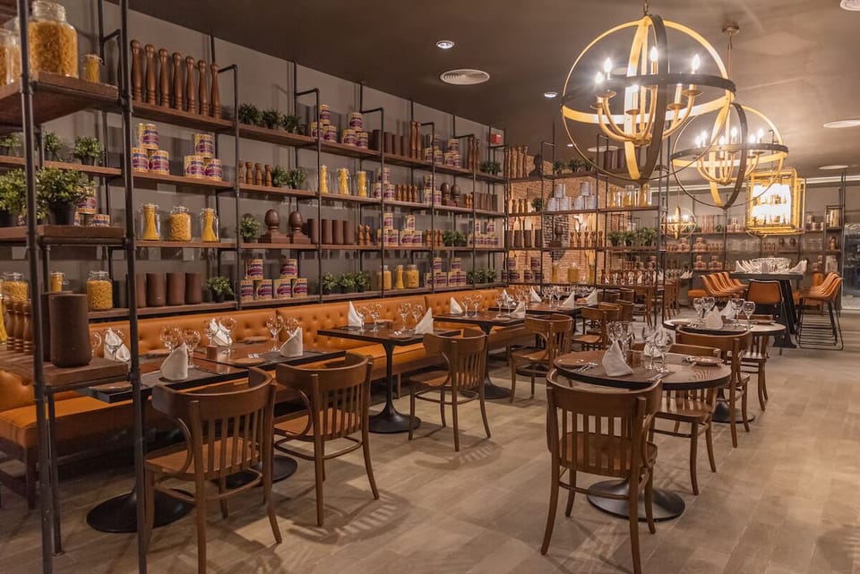 Gather for cocktails beneath warm lighting and dramatic architecture.