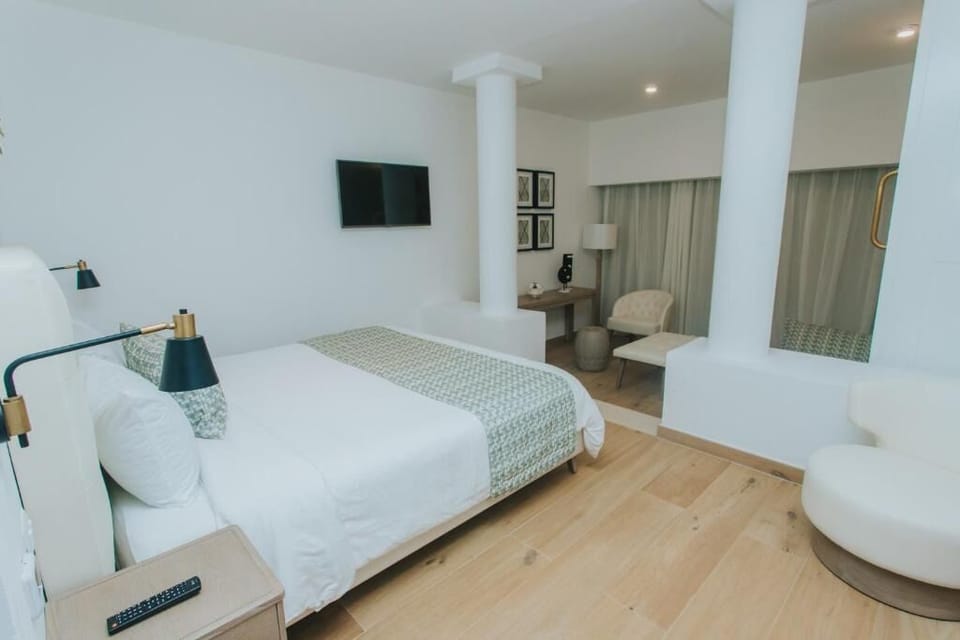 Enjoy movie nights from bed in a calm, airy room