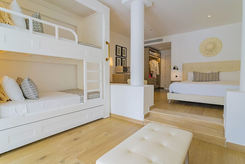 Unwind in a bright suite with king bed and bunks.