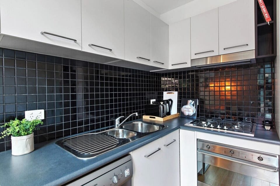 The compact kitchen is perfect for whipping up breakfast, lunch or dinner thanks to a double sink, oven, stove and dishwasher for easy clean up
