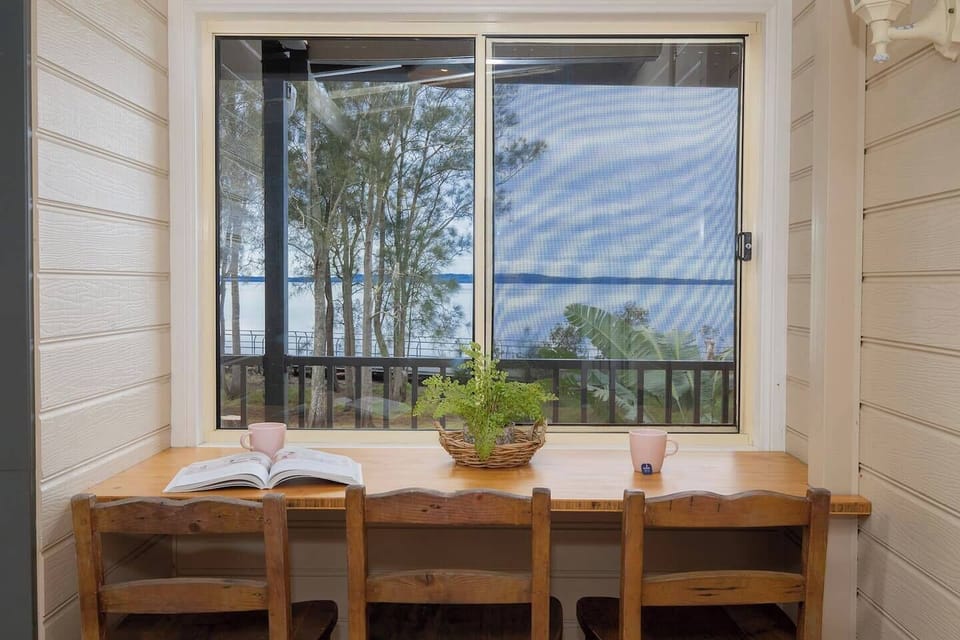 Settle in at the timber desk overlooking Tuggerah Lake—whether you're logging in for work or journaling at sunrise, this peaceful nook turns productivity into a pleasure.