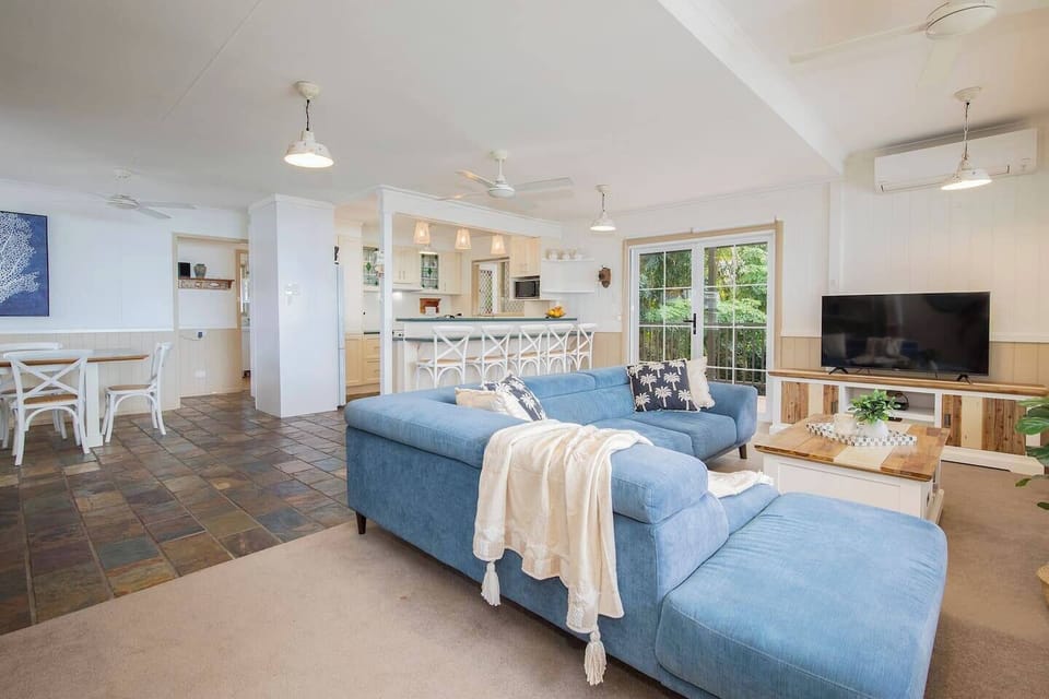 Enjoy effortless flow between the lounge, dining, and kitchen, all bathed in natural light and designed for connection and comfort.