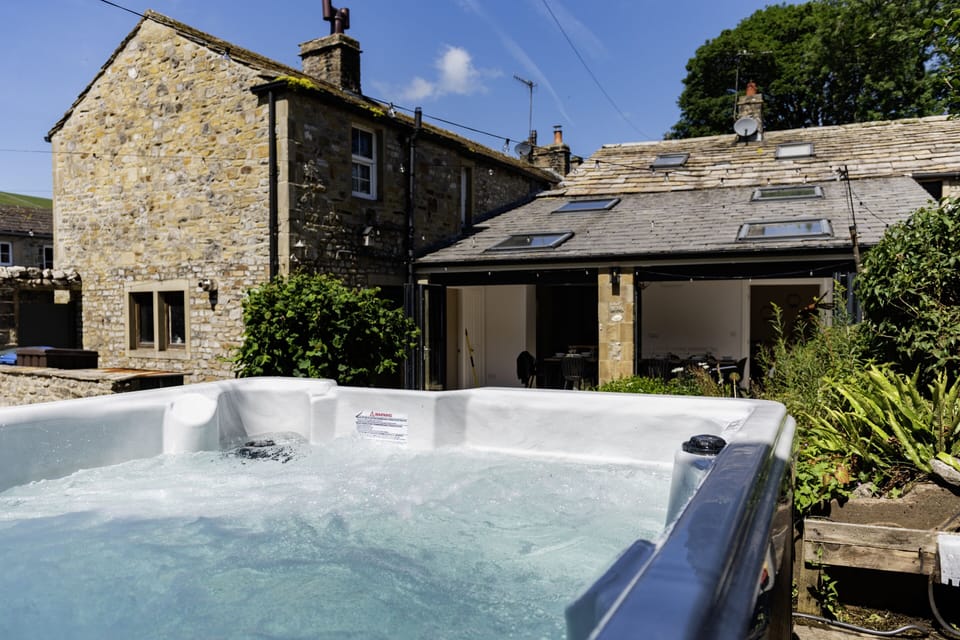 The view from our warm and inviting hot tub is something truly special.

Ready and heated all year round - whether for long summer evenings or crisp winter nights - it’s the perfect place to relax beneath beautiful outdoor lighting while taking in the stunning views of the rolling hills beyond.