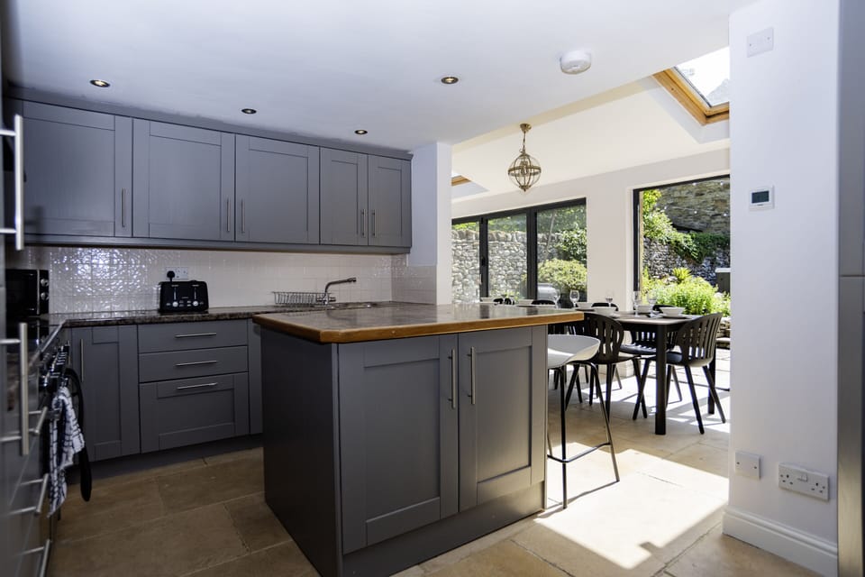 Our large kitchen diner is a standout feature within our stunning cottage - the perfect setting for family meals, group get-togethers, or intimate private dining experiences.

Gather around the table, cook together in the spacious kitchen, or elevate your stay and ask us about our private chef options for a truly memorable evening in.