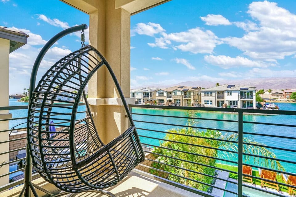 A view of the pool, lake and mountain in your private balcony (bedroom 1)