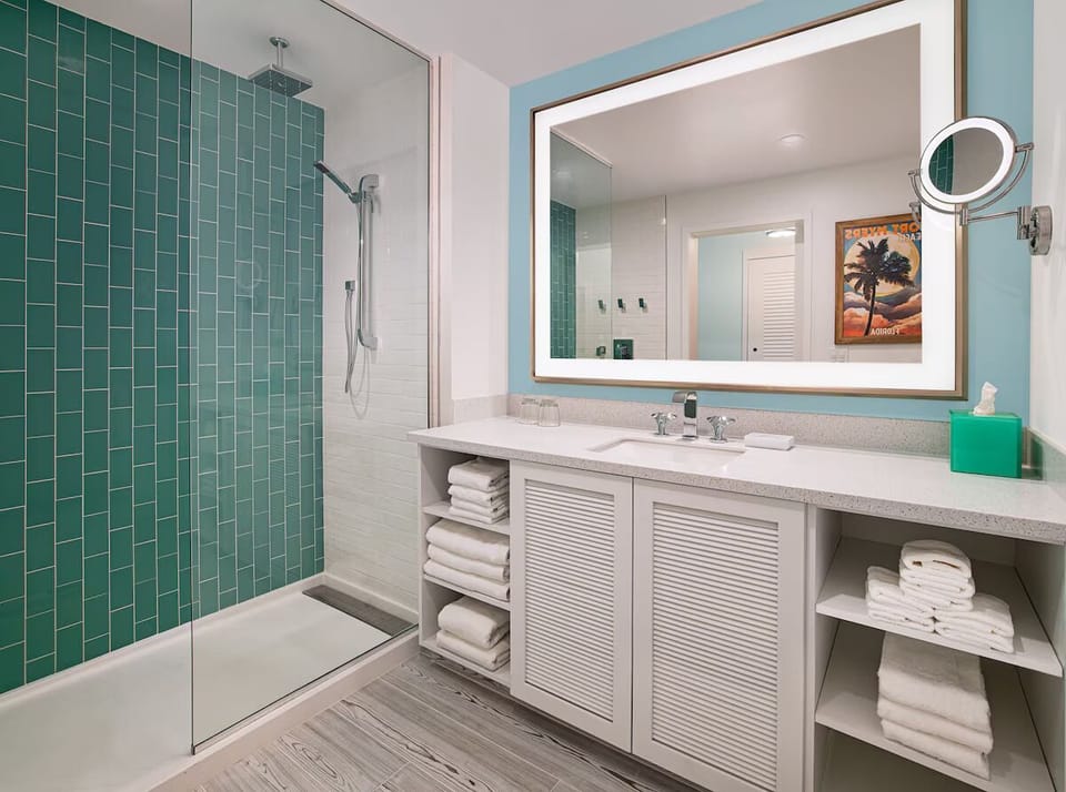 Refresh in a sleek, spa-bright bathroom with plush towels.