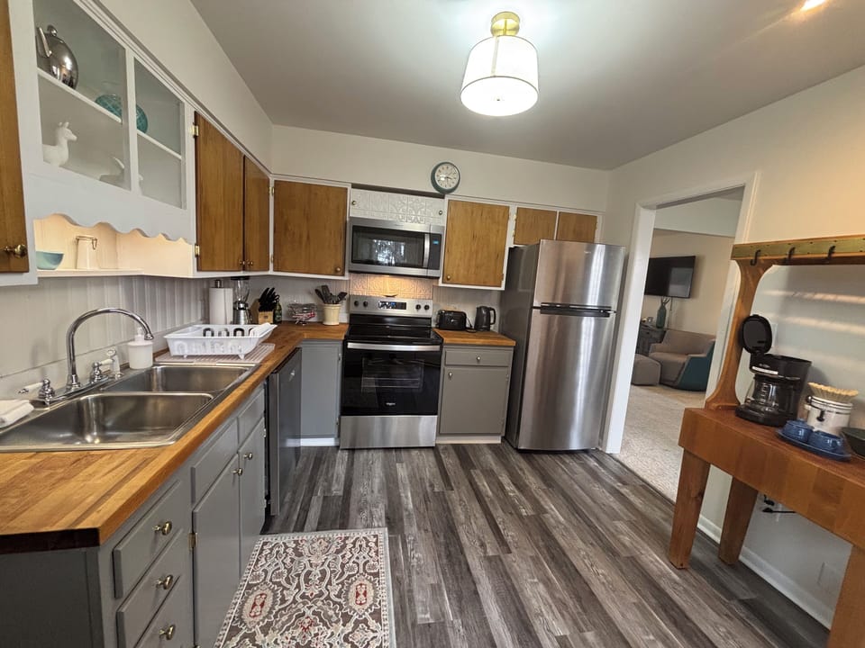 Full kitchen with stainless appliances and generous counter space
