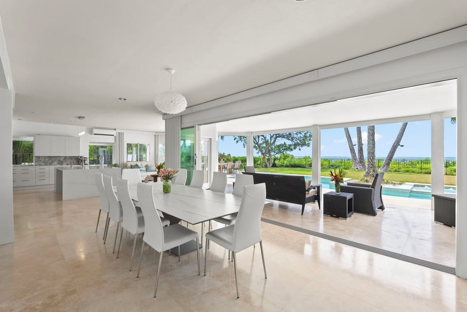 Dine in elegance with ocean vistas as your backdrop—this open-air formal dining space blends natural light with timeless style.