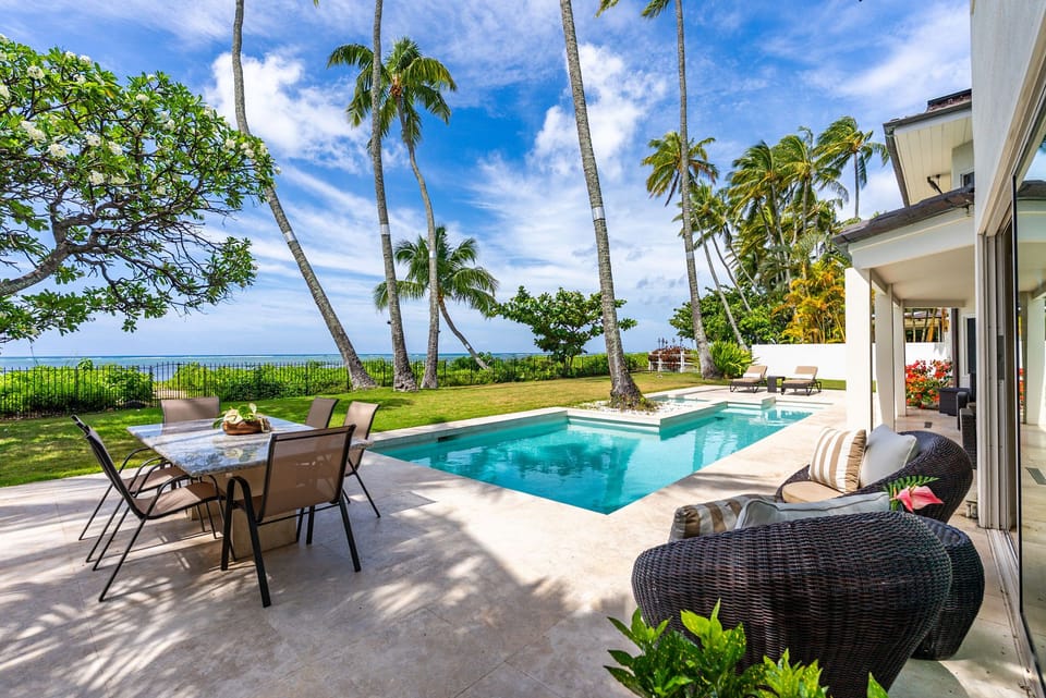 Enjoy meals and lounging just steps from the pool—where the ocean view stretches endlessly across the horizon.