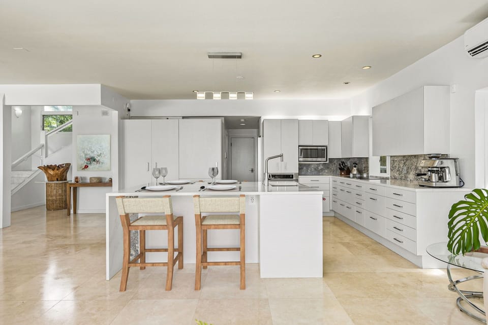 Prep, serve, and socialize with ease at this oversized kitchen island featuring seating and views into the bright great room.