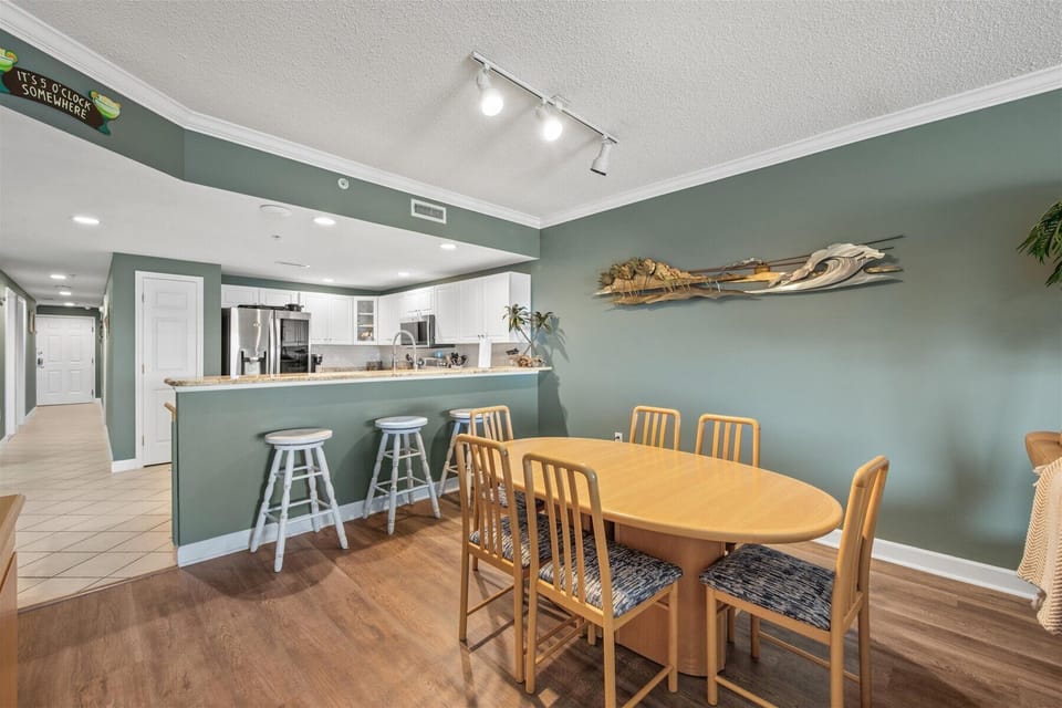 This home has a Dining Room Table and a Breakfast Bar!
