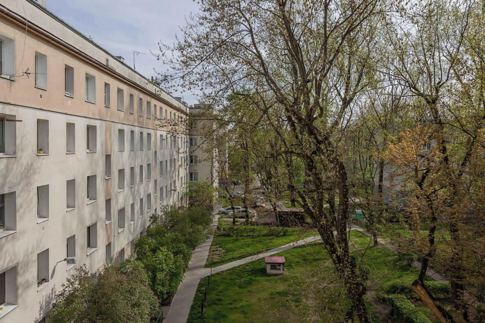 The view from the window onto the green courtyard brings a sense of calm, even in the city center.