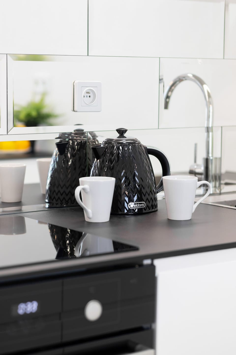 Kitchenette with a kettle.