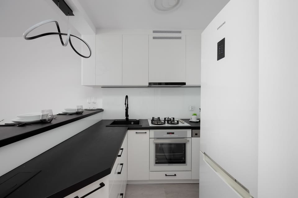 Bright, modern kitchen with a spacious countertop encourages effortless cooking.