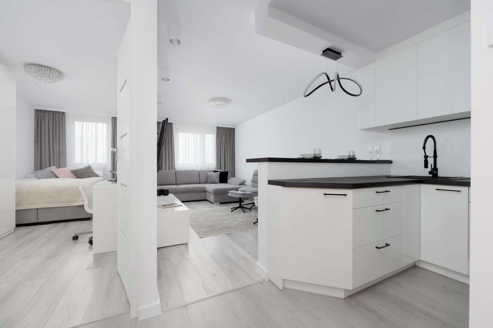 The kitchen island blends functionality with style, offering a practical spot for cooking and dining.