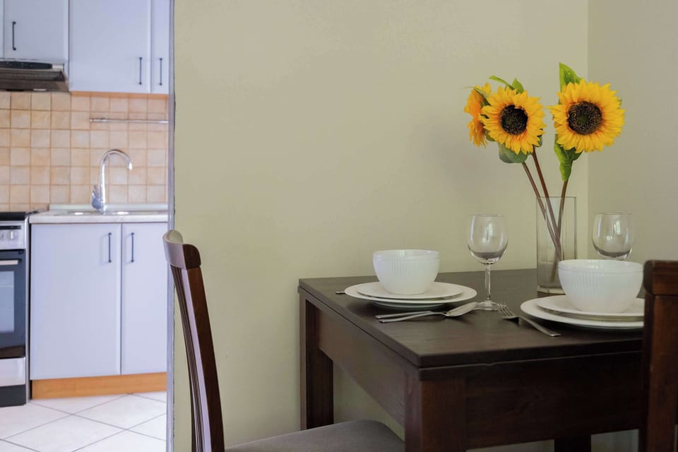 Details like fresh flowers and tableware create a warm, welcoming feel.