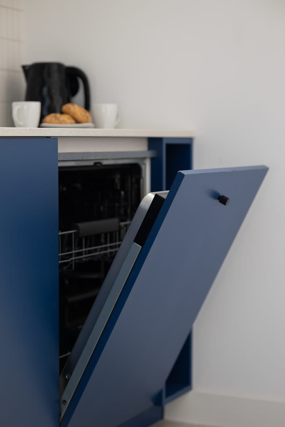 Close-up of the built-in dishwasher in the kitchenette.