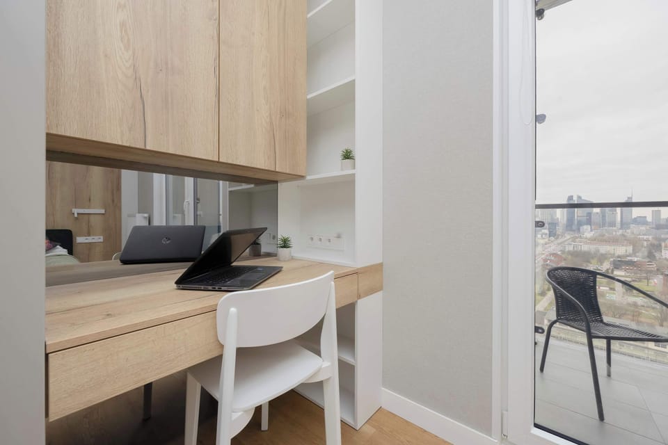 A desk and chair in the bedroom provide a functional workspace, ideal for remote work or studying.