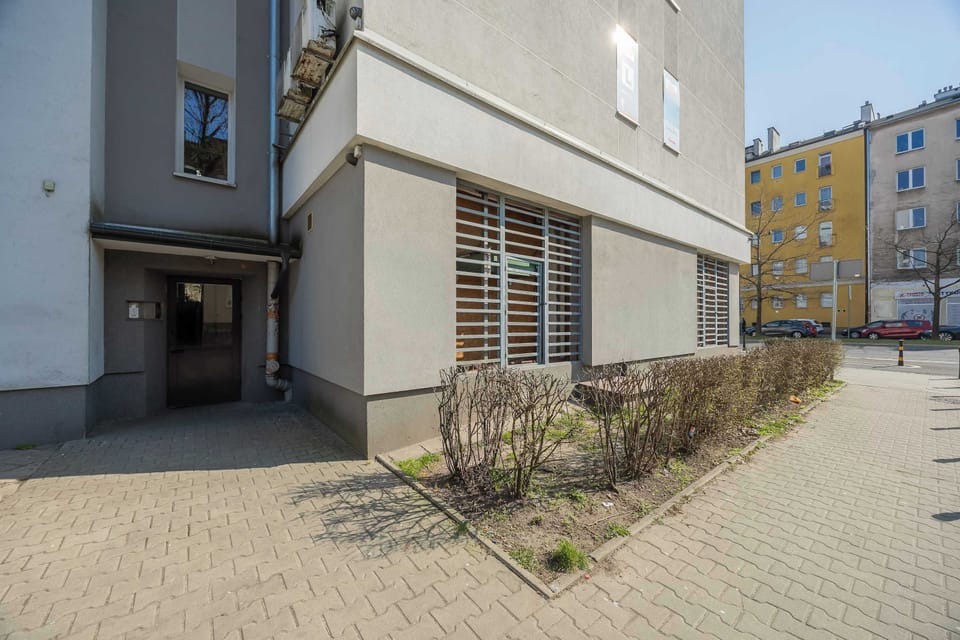 An exterior view of the building with a courtyard, showing a modern architectural design.