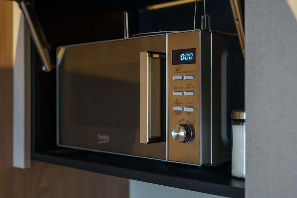 A built-in microwave in the kitchen, highlighting modern appliances and efficiency.
