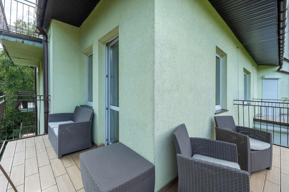 The furnished balcony invites you to relax outdoors in the evening.