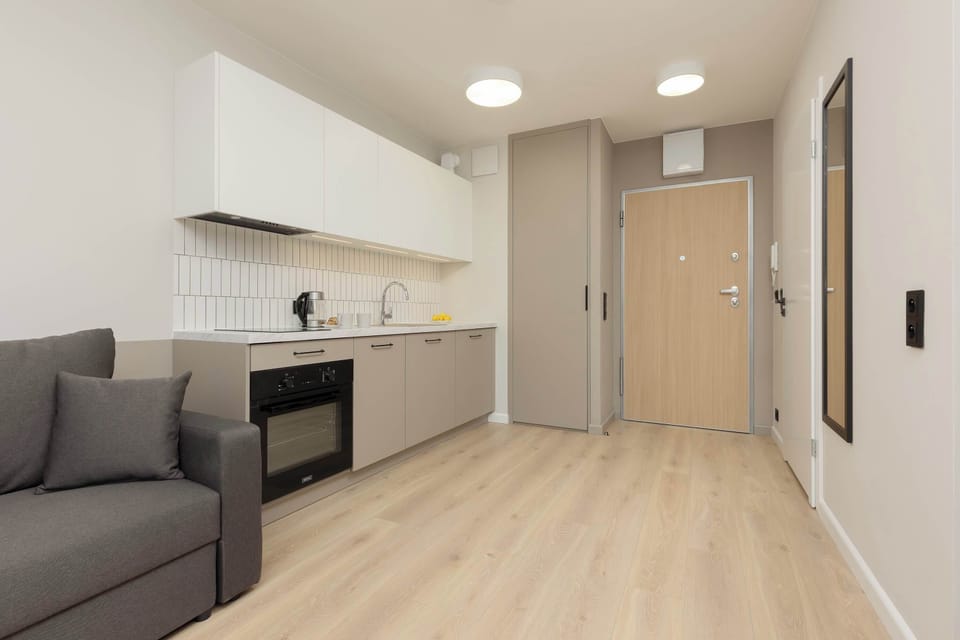 Fully equipped kitchenette with dining table and chairs.