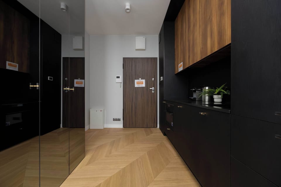 A spacious hallway with a large mirror makes getting ready easier and visually expands the space.