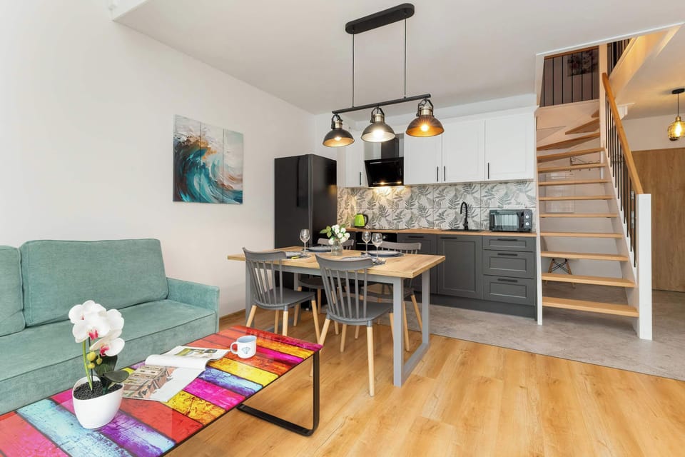 Living room and modern kitchenette.