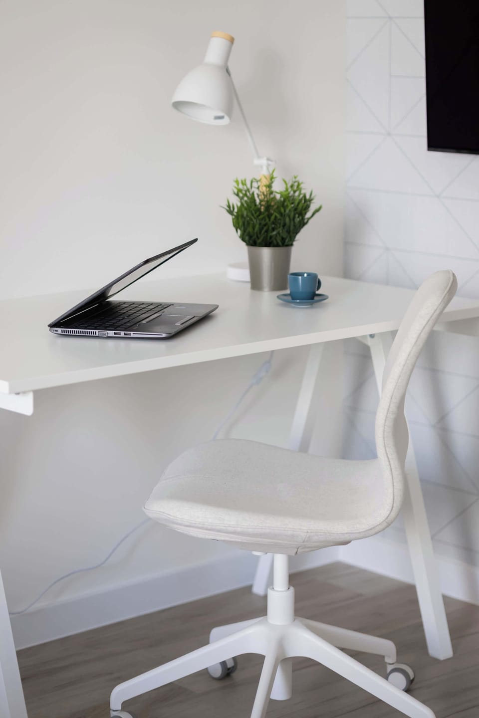 A compact yet practical workspace supports focus and comfort during remote work.