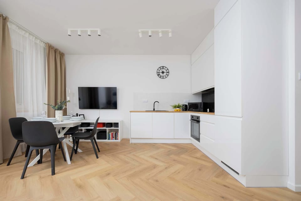 Modern combination of living area with functional kitchenette.