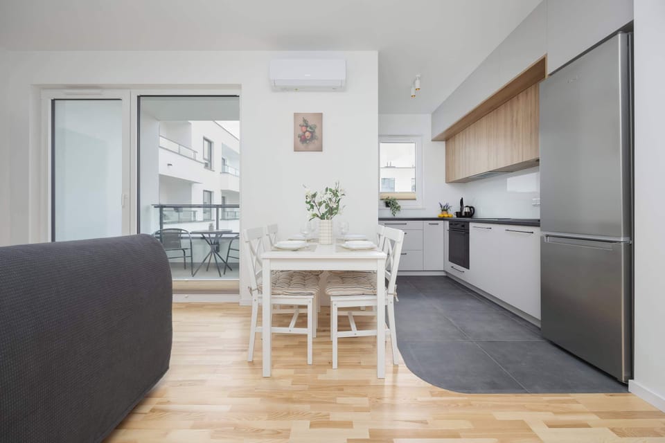 The living room's modern and stylish decor creates a welcoming atmosphere.