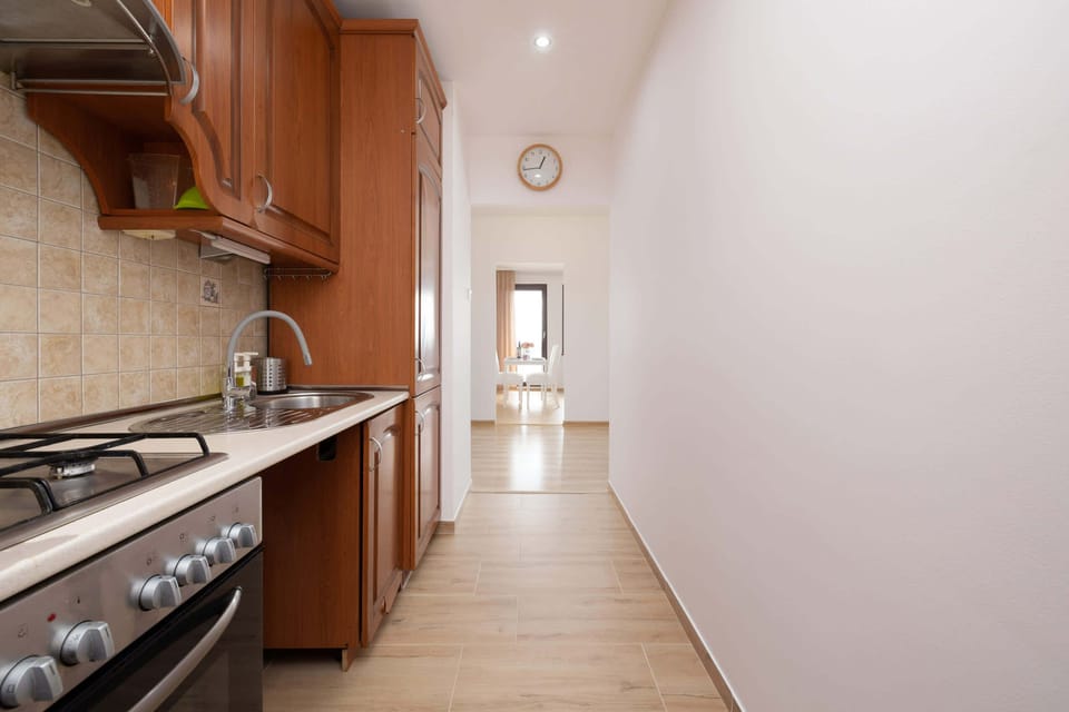 Kitchen with oven and refrigerator. 