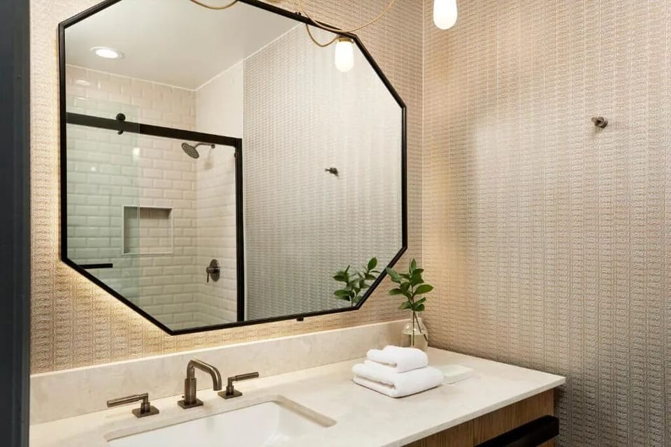 Get ready comfortably with a glowing mirror and spacious counter.