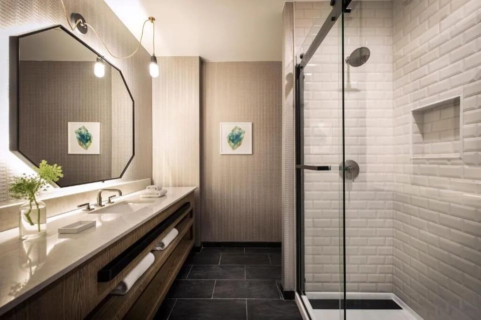 Refresh under the rainfall shower after a long day out.