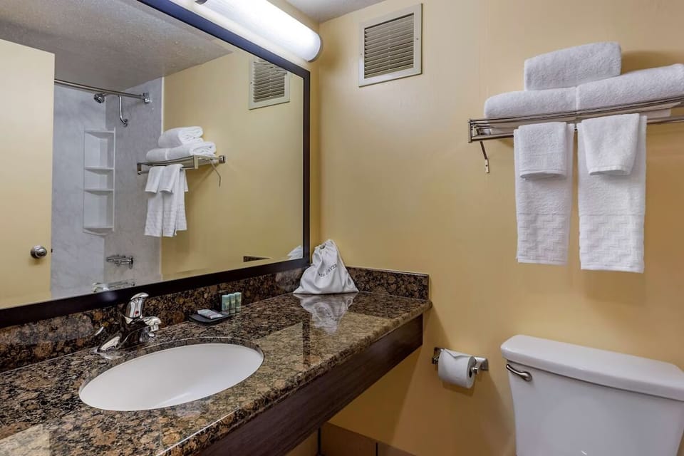 Refresh at the granite vanity with bright, easy lighting.