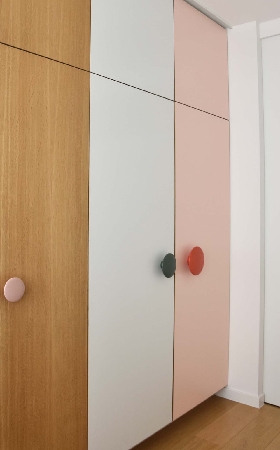 Hallway Closet with Colorful Knobs