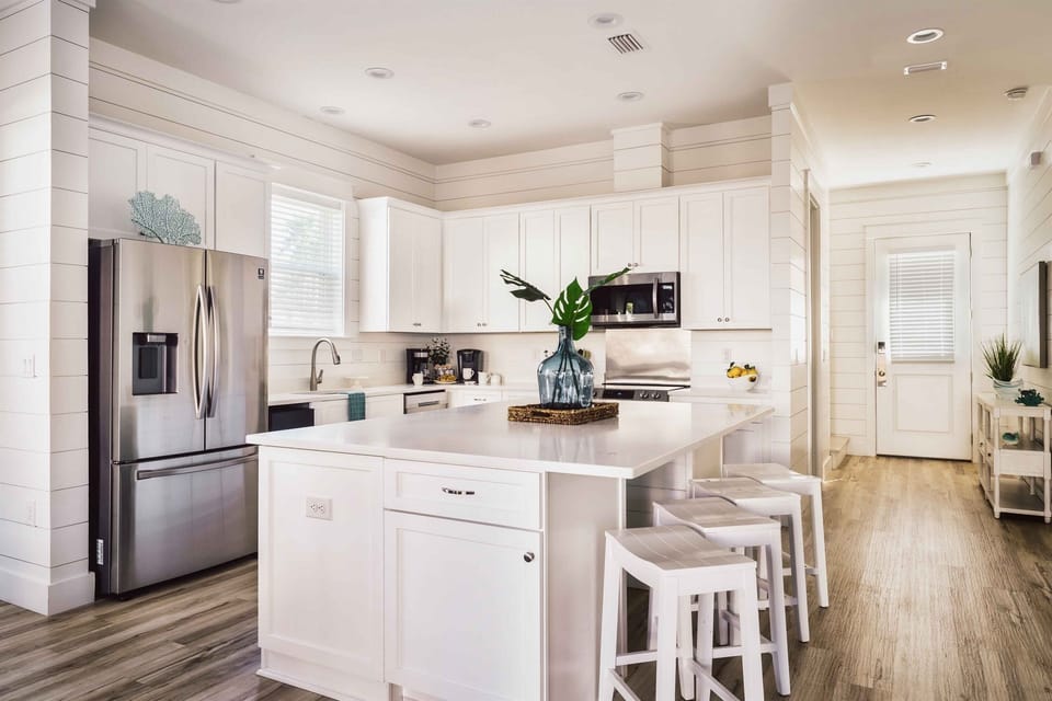 GOURMET, FULLY-STOCKED KITCHEN: Cook in style with upscale appliances, custom cabinetry, and a large ice maker all with Pool and Hot Tub Views!
