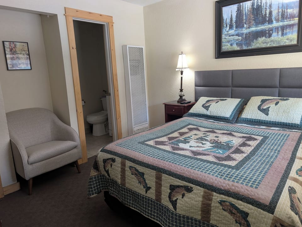 Cozy bedding with fisherman theme throughout the studio. 