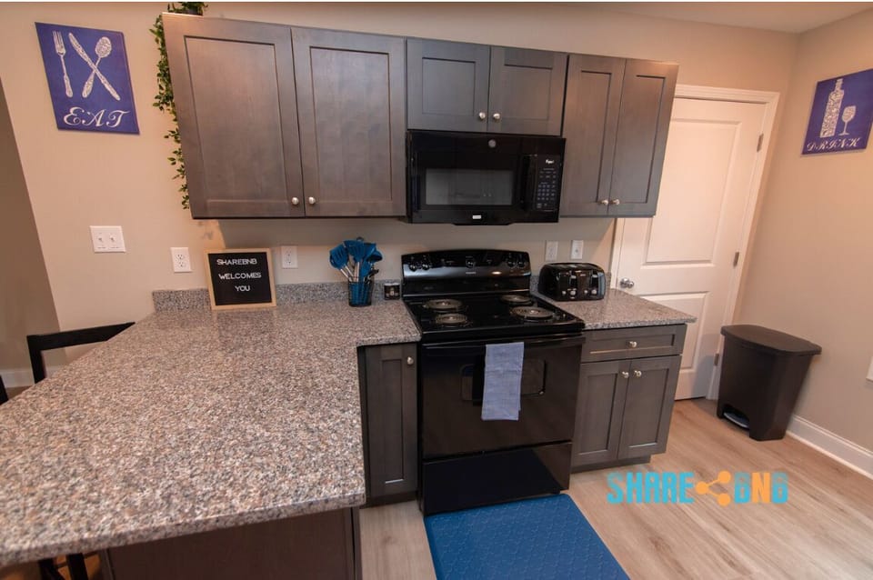 Cook up comfort in this fully stocked kitchen with modern appliances and granite countertops.