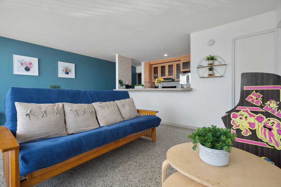 Cozy living space with comfortable blue sofa. Ideal for relaxation and making memories