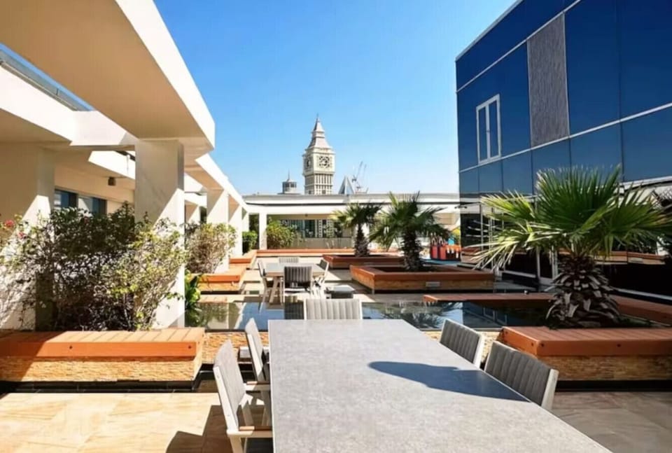Rooftop Oasis: Savor breathtaking views while dining in style amidst lush greenery!