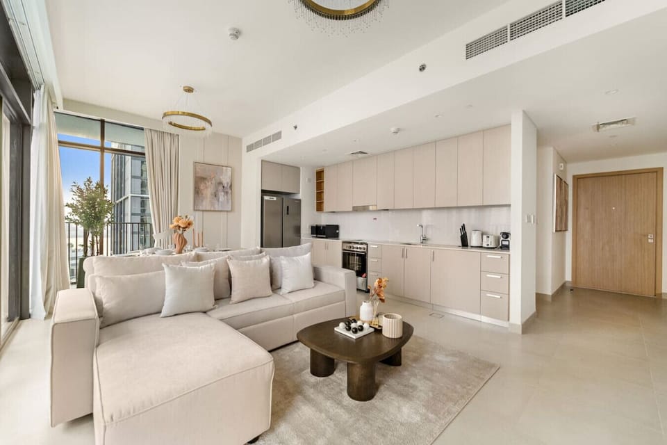 Living Room: Bright, modern space with chic decor and city views for ultimate relaxation.