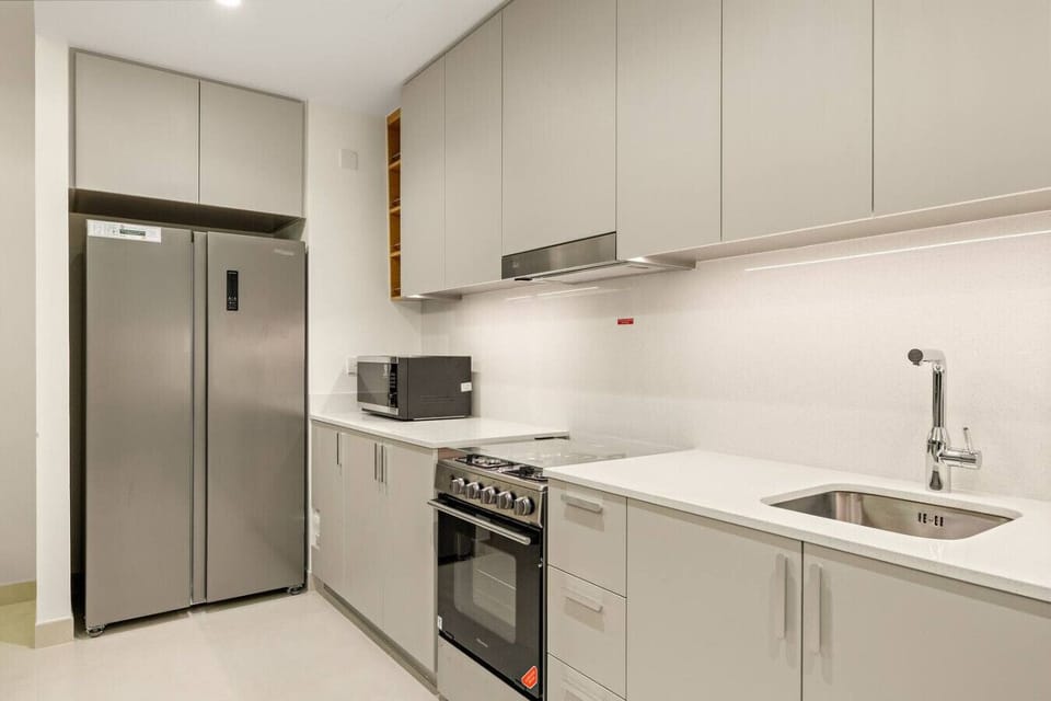 Modern Kitchen: Sleek countertops and top-notch appliances await your culinary adventures!