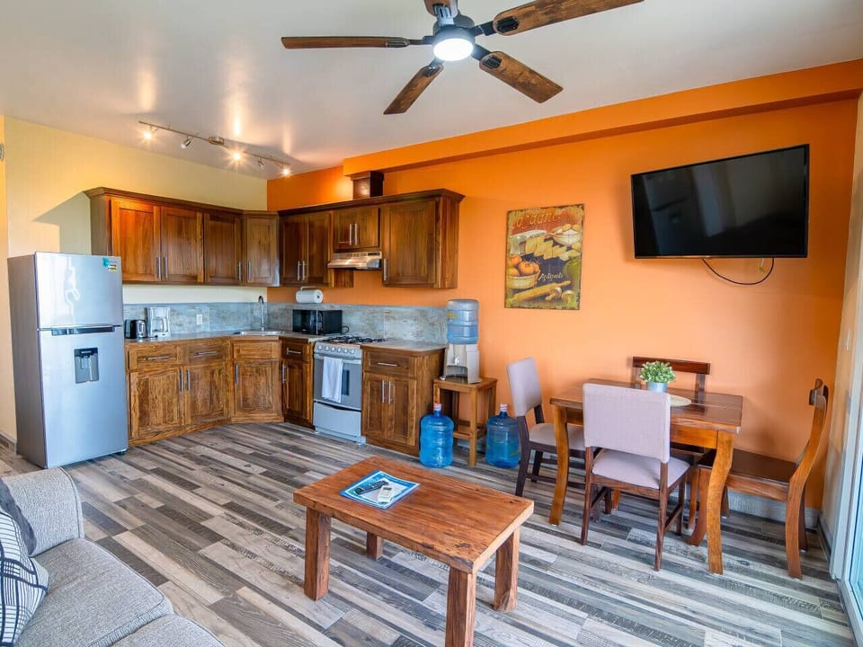 Full gourmet kitchen with Honduran hardwood cabinetry—crafted for beauty and function, offering guests the luxury of cooking in style.