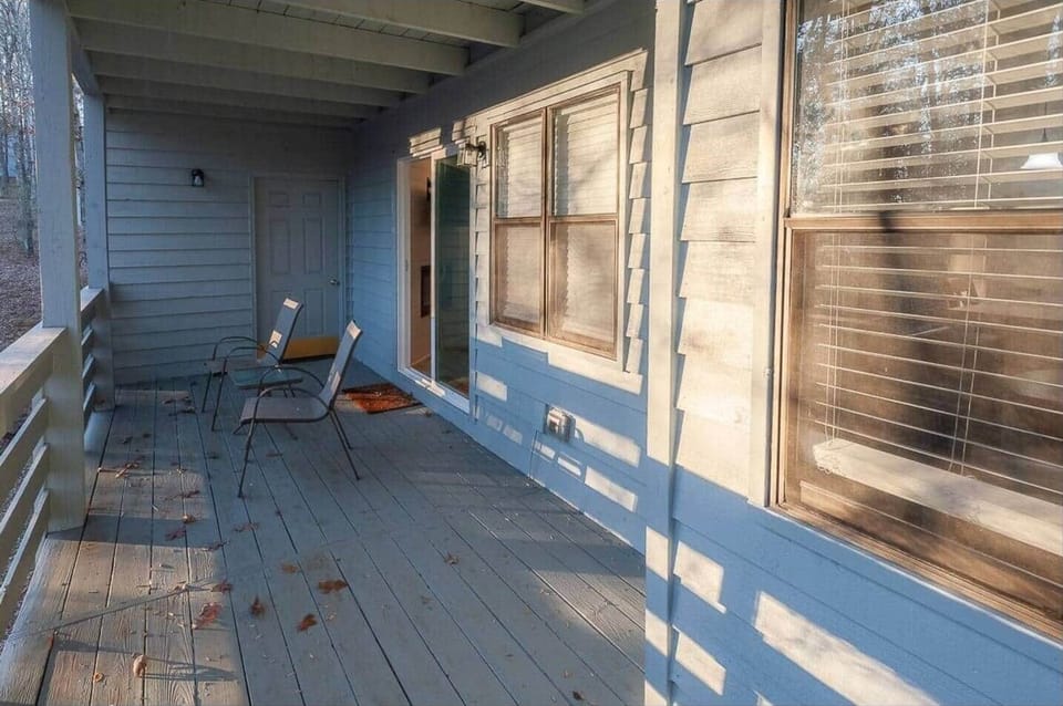 Start your morning or wind down at sunset on this peaceful private balcony. With two chairs and warm natural light, it’s the perfect spot to sip coffee, read, or enjoy the quiet charm of the surrounding woods.