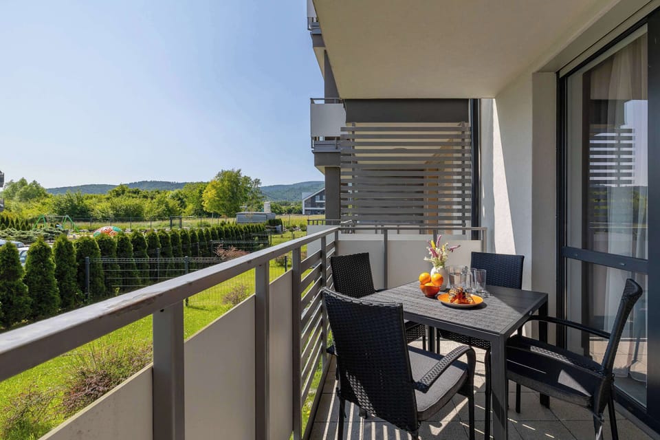 The balcony provides a perfect spot for enjoying the fresh air. 