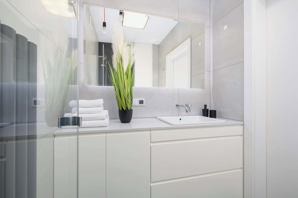 The bathroom offers a clean and functional space for your stay. 