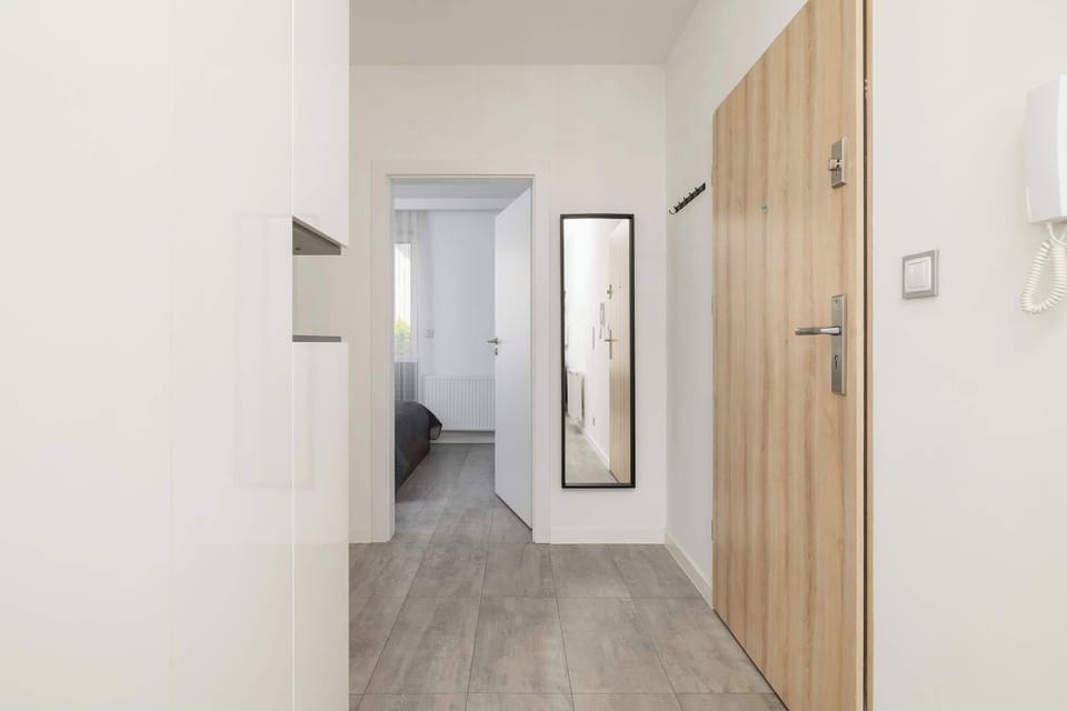 The living room's sleek design is both functional and aesthetically pleasing.