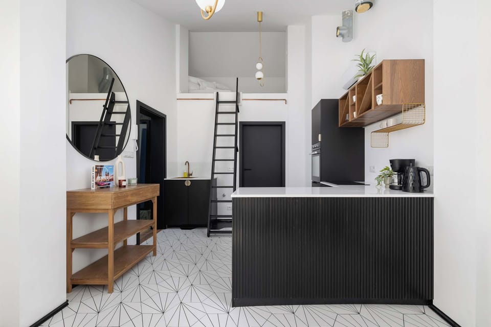 A straight-on view of the kitchen area, showing all appliances and workspace.